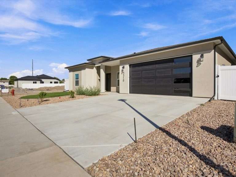 3310 Pyrus Street front exterior and driveway, Clifton, CO new home by Integrity Homes
