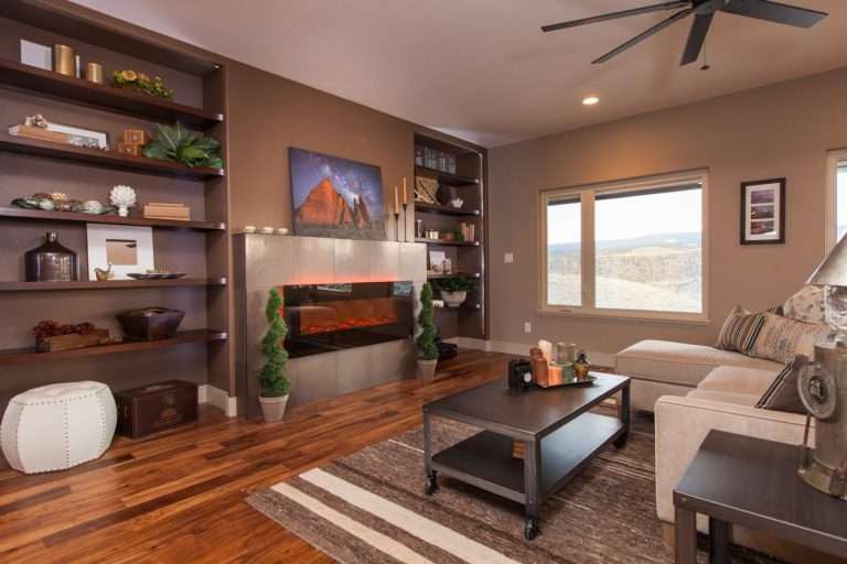 The Prestige living room with fireplace, new home by Integrity Homes in Western Colorado