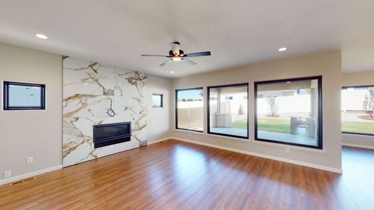 Casa De Pueblo living room with fireplace, new home by Integrity Homes in Western Colorado
