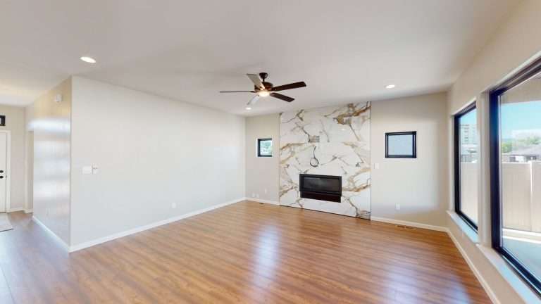 Casa De Pueblo living room with fireplace, new home by Integrity Homes in Western Colorado