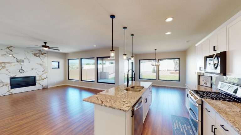 Casa De Pueblo kitchen and living room, new home by Integrity Homes in Western Colorado