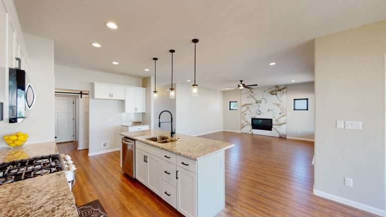 Casa De Pueblo kitchen and living room, new home by Integrity Homes in Western Colorado