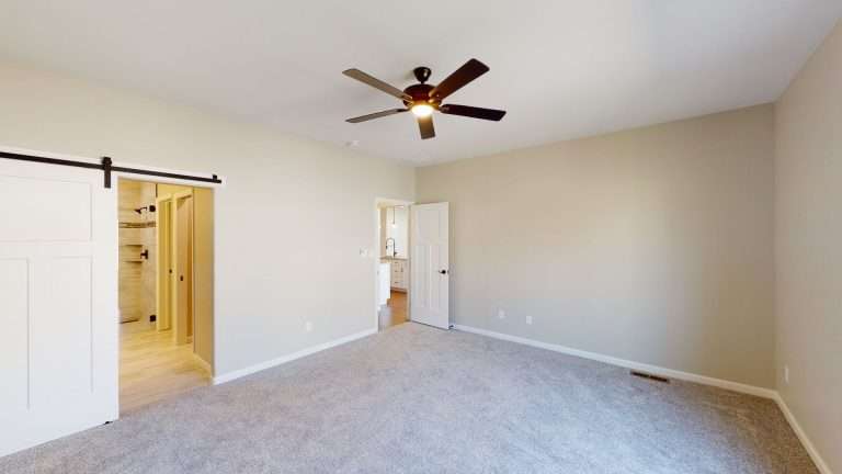Casa De Pueblo primary bedroom, new home by Integrity Homes in Western Colorado