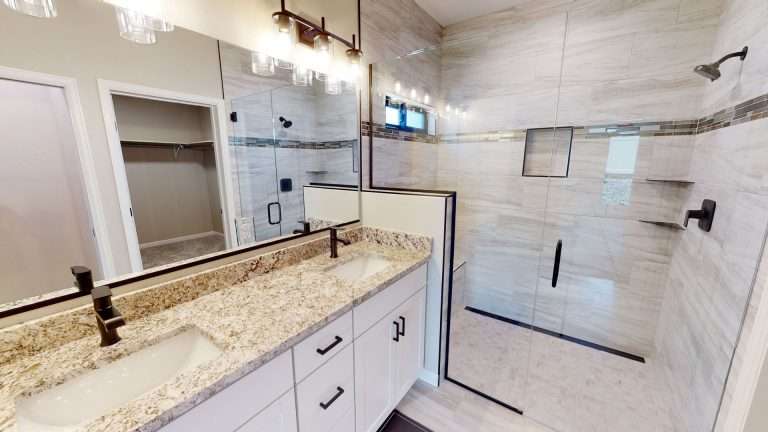 Casa De Pueblo primary bathroom with walk-in shower, new home by Integrity Homes in Western Colorado