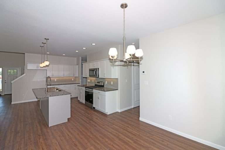 The Garfield kitchen and dining area, new home by Integrity Homes in Western Colorado