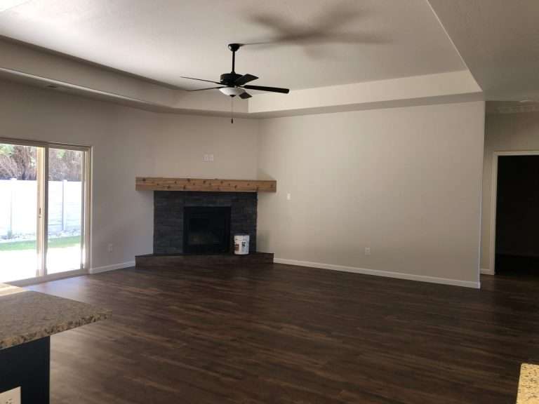 The Rubí living room with fireplace, new home by Integrity Homes in Western Colorado