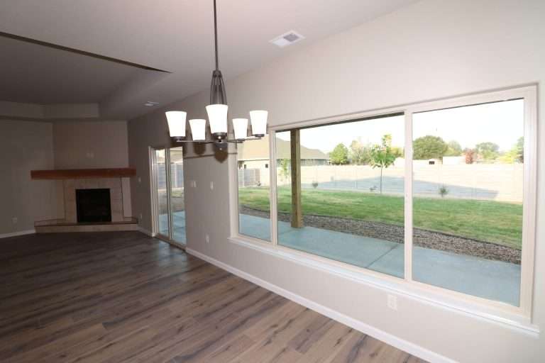 The Rubí dining area and living room, new home by Integrity Homes in Western Colorado