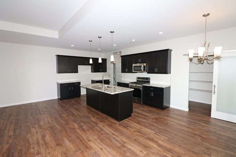 The Rubí kitchen and dining area, new home by Integrity Homes in Western Colorado