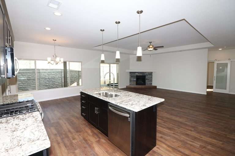 The Rubí great room and kitchen, new home by Integrity Homes in Western Colorado