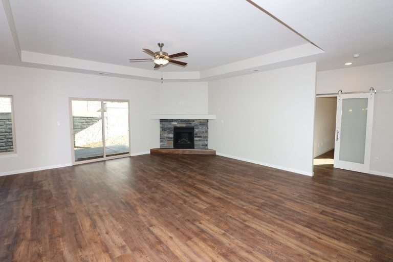 The Rubí living room with fireplace, new home by Integrity Homes in Western Colorado