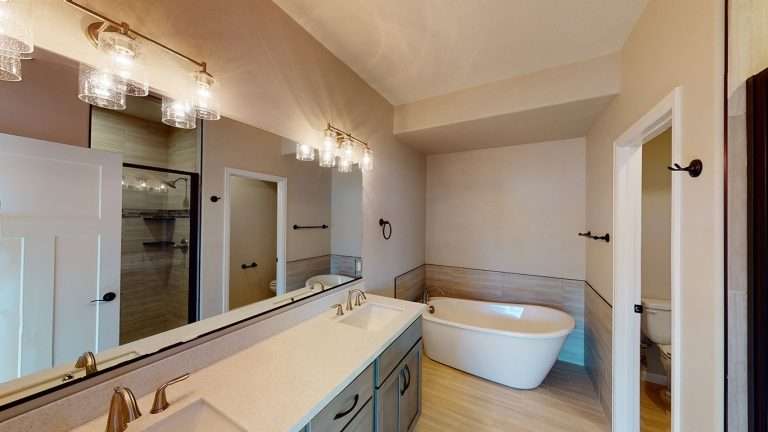 The Zafiro primary bathroom with freestanding tub, new home by Integrity Homes in Western Colorado