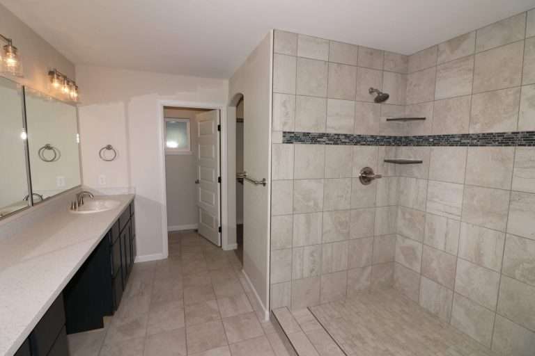 The Diamante primary bathroom with walk-in shower, new home by Integrity Homes in Western Colorado