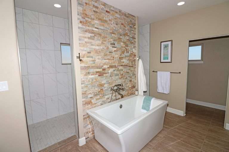 The Ridge primary bathroom with freestanding tub, new home by Integrity Homes in Western Colorado