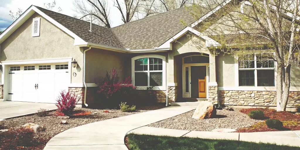 A new move-in ready home in Clifton, CO with a modern exterior and landscaped yard.